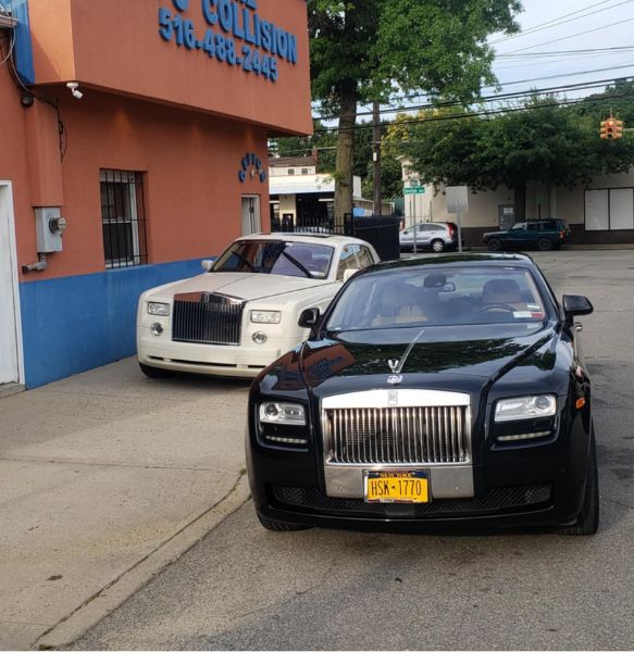Two Bentley cars parked outside Frame Auto Collision auto body shop in New Hyde Park, Nassau County NY