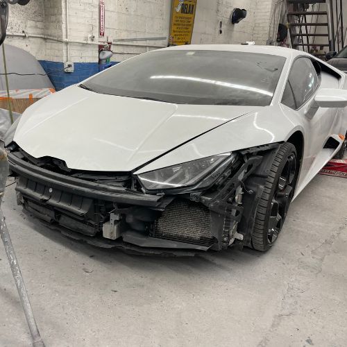 Damaged Lamborghini before collision repair at Frame Auto Collision in Nassau County N